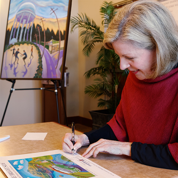 Beverly Harper signing calendars